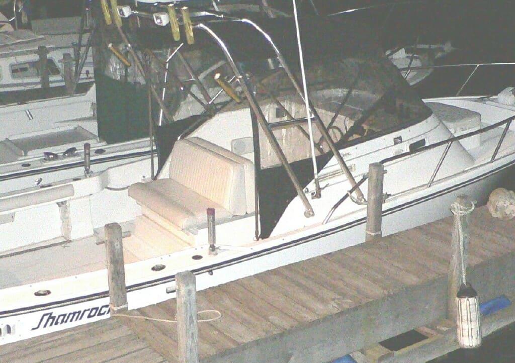 Atlantic Towers Arch installed on a Shamrock 22 Walk Around boat docked at night.