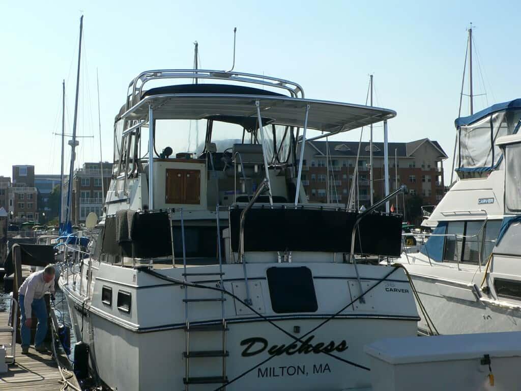 Atlantic Towers Aft Deck Top installed on a Carver 36 Aft Cabin boat at a marina.