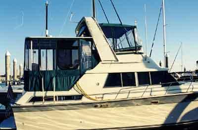 Atlantic Towers Aft Deck Top installed on Silverton 40 Aft Cabin boat shown from the side on water.