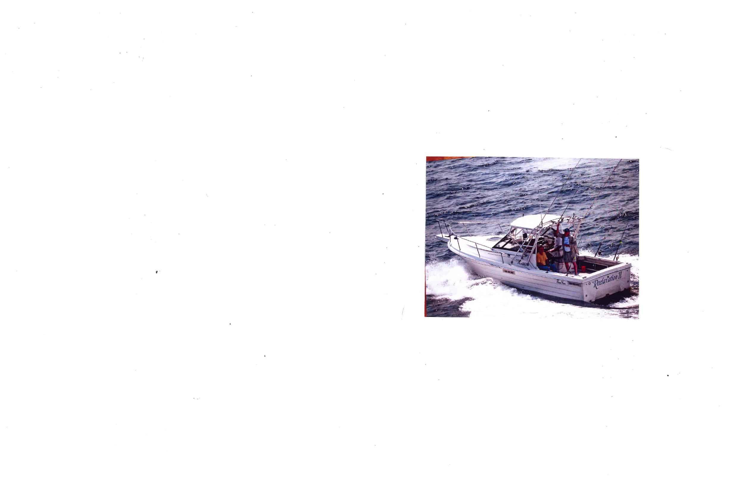 Penn Yan 268 Sea Hunter boat with Atlantic Towers Top installed, carrying people fishing on ocean water.