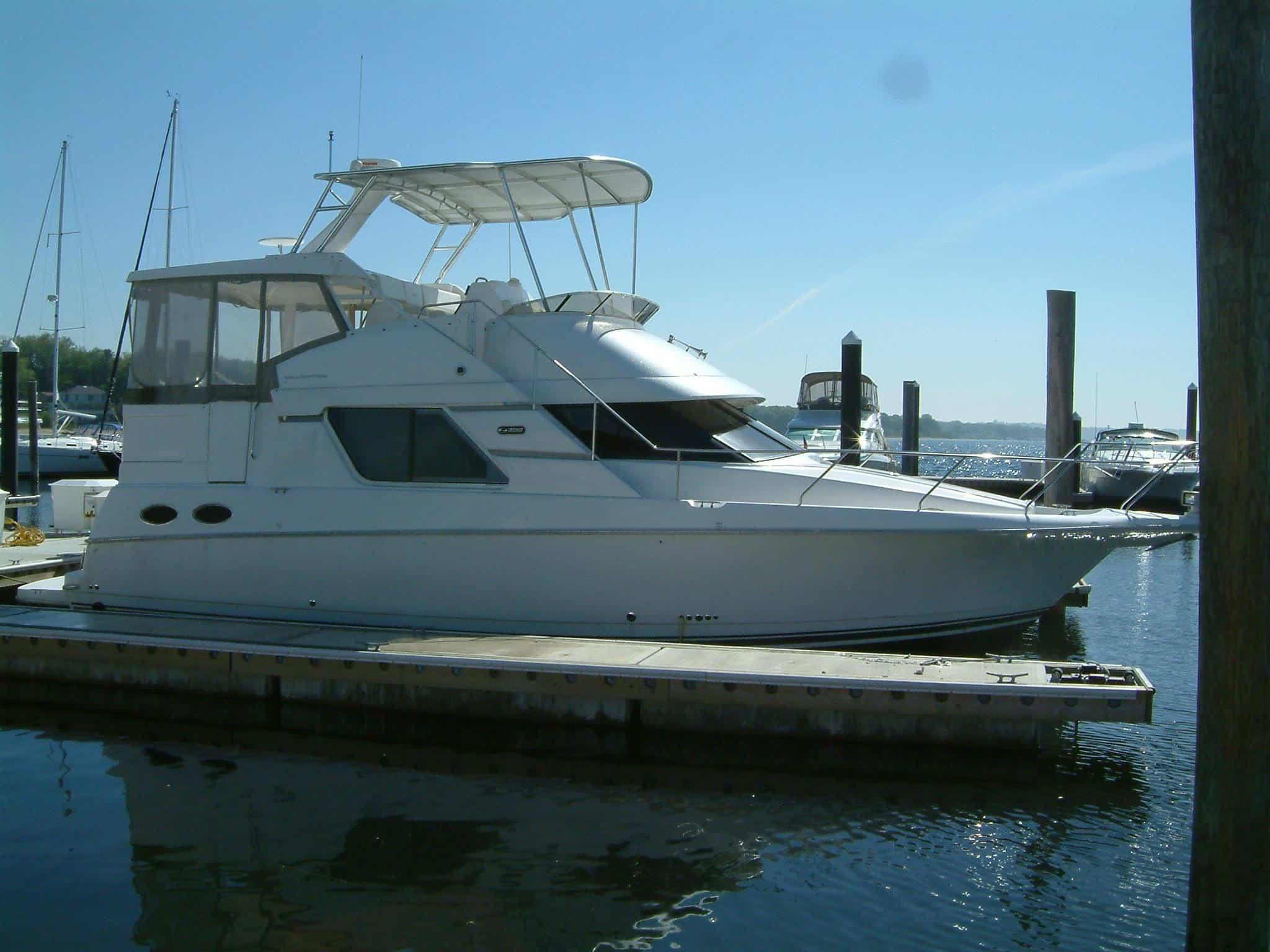 Atlantic Towers Top installed on a Silverton 392 Motoryacht docked at a marina under clear blue skies.