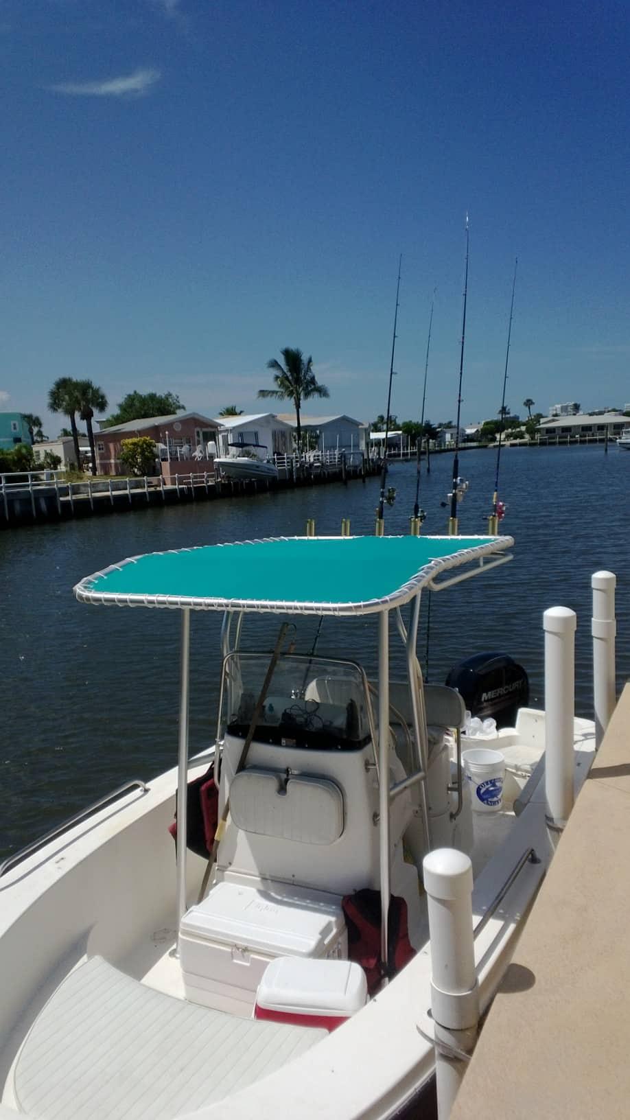 Atlantic Towers T-Top installed on a Trophy 1903 center console boat shown from the side on water.