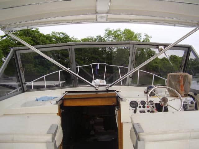 Atlantic Towers Top installed on the helm of an Alura 30 boat, showcasing the dashboard and surrounding views.