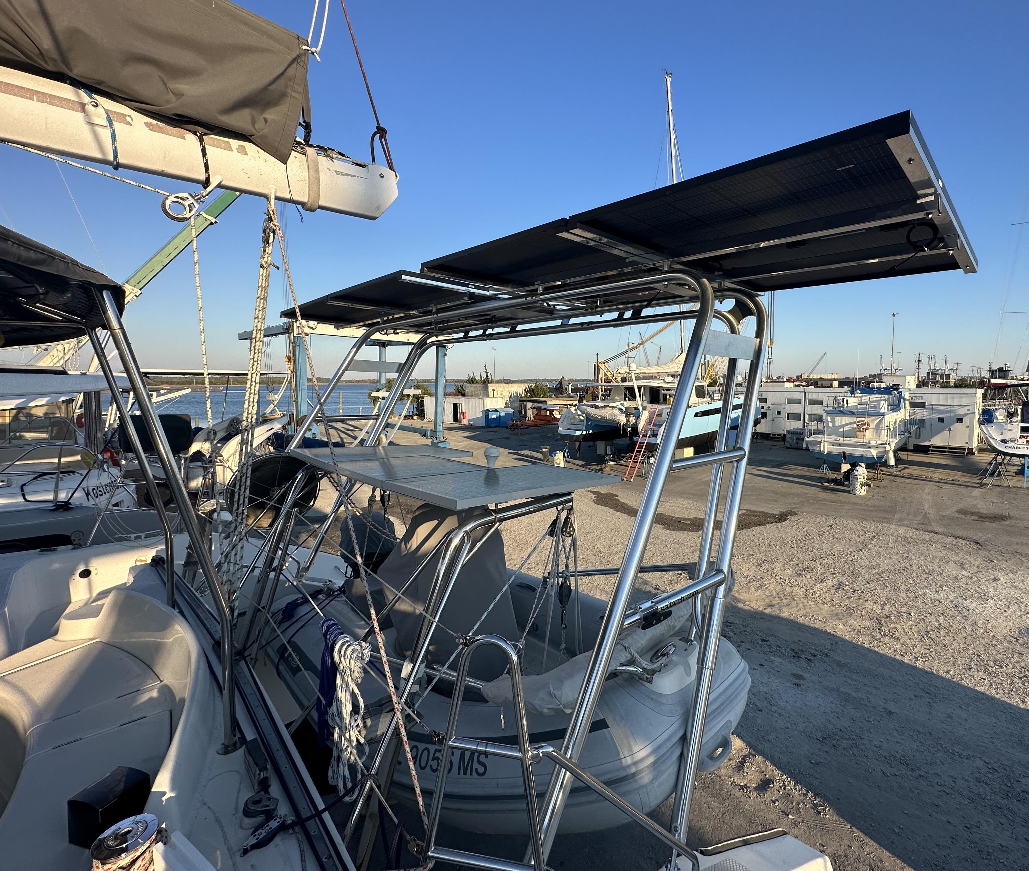 Atlantic Towers Arch installed on a boat, featuring solar panels and a scenic marina in the background.