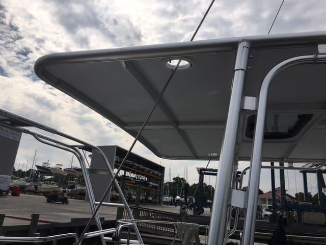 Atlantic Towers Top installed on a Catalina boat providing shade and structure above the cockpit area at a marina.