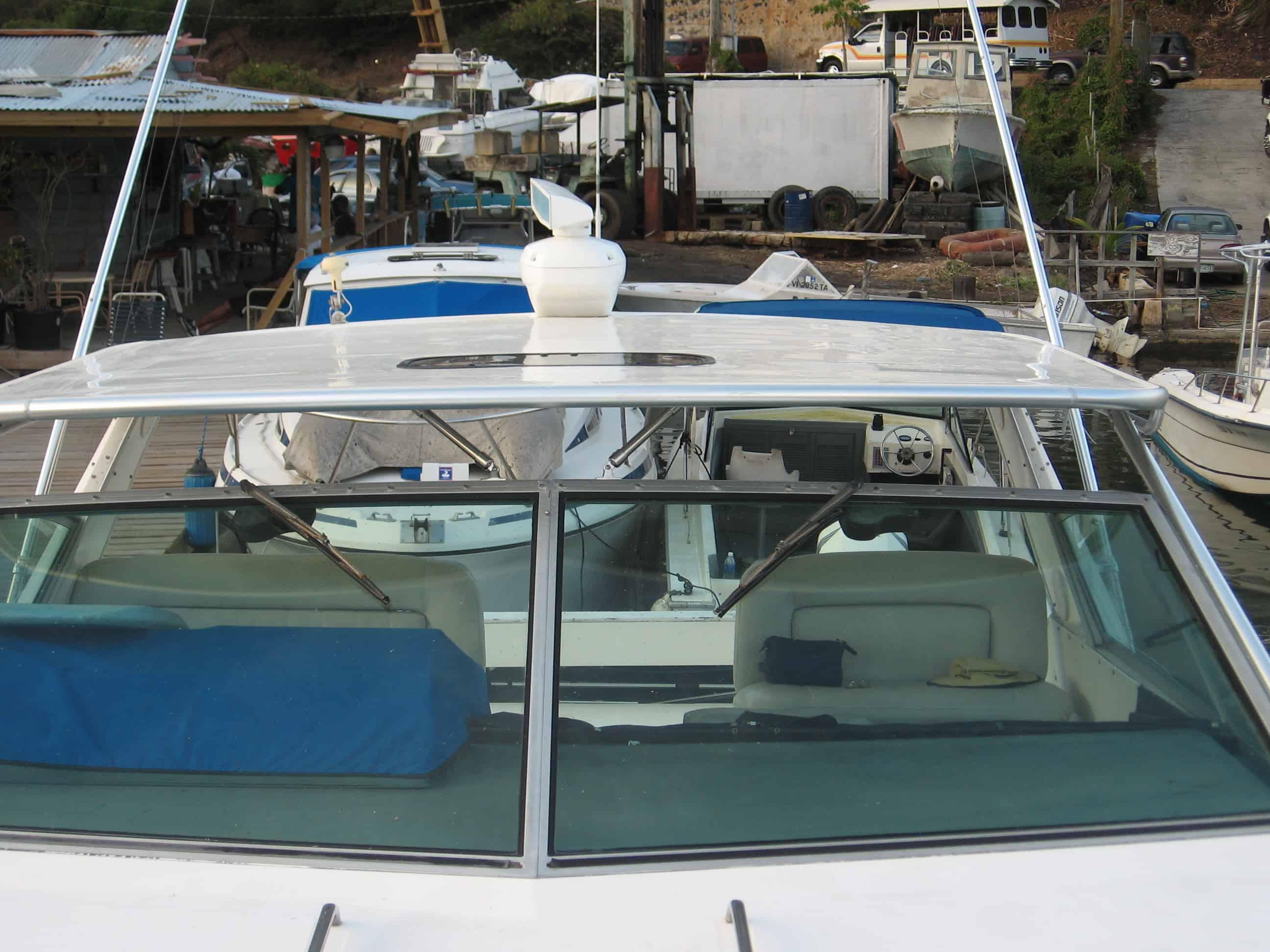 Atlantic Towers Top installed on a Sea Ray 390 Express Cruiser, showing the boat's deck and water background.