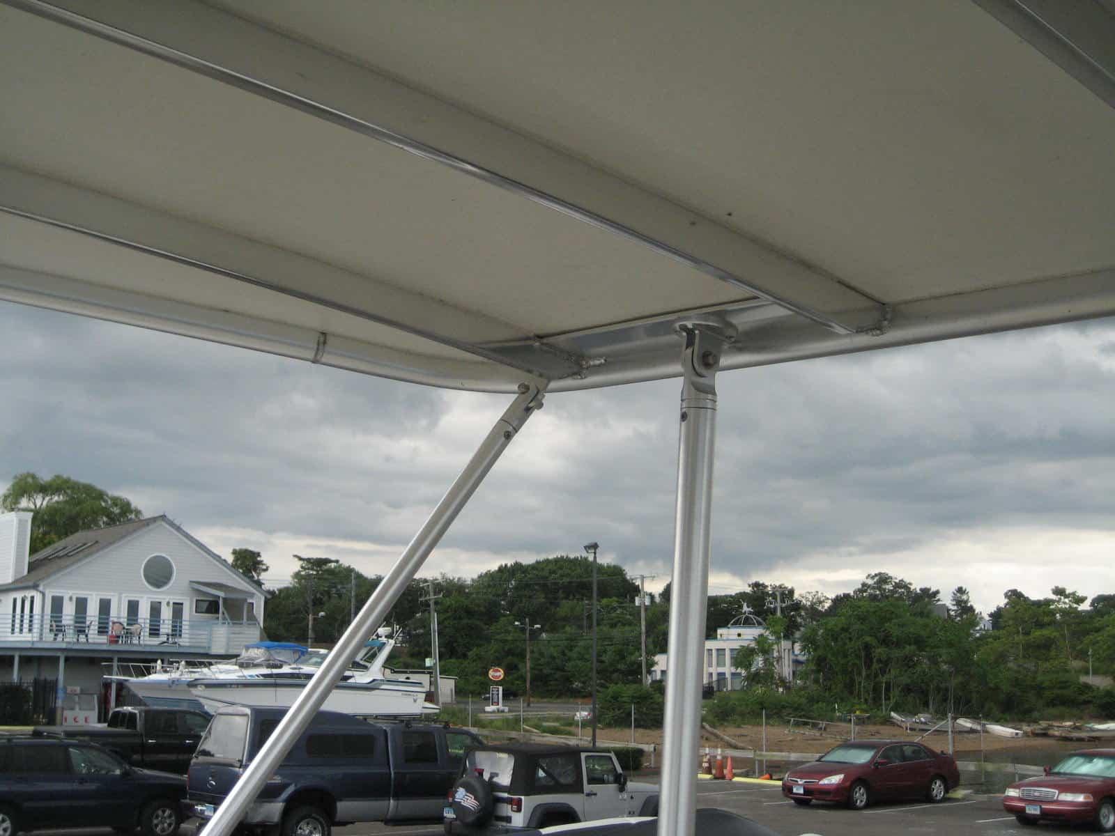 Atlantic Towers Top installed on an Egg Harbor 37 Convertible boat with blue canvas and stainless steel frame