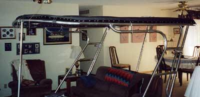 Atlantic Towers Top installed on a Silverton 40 Convertible boat frame displayed indoors over furniture.