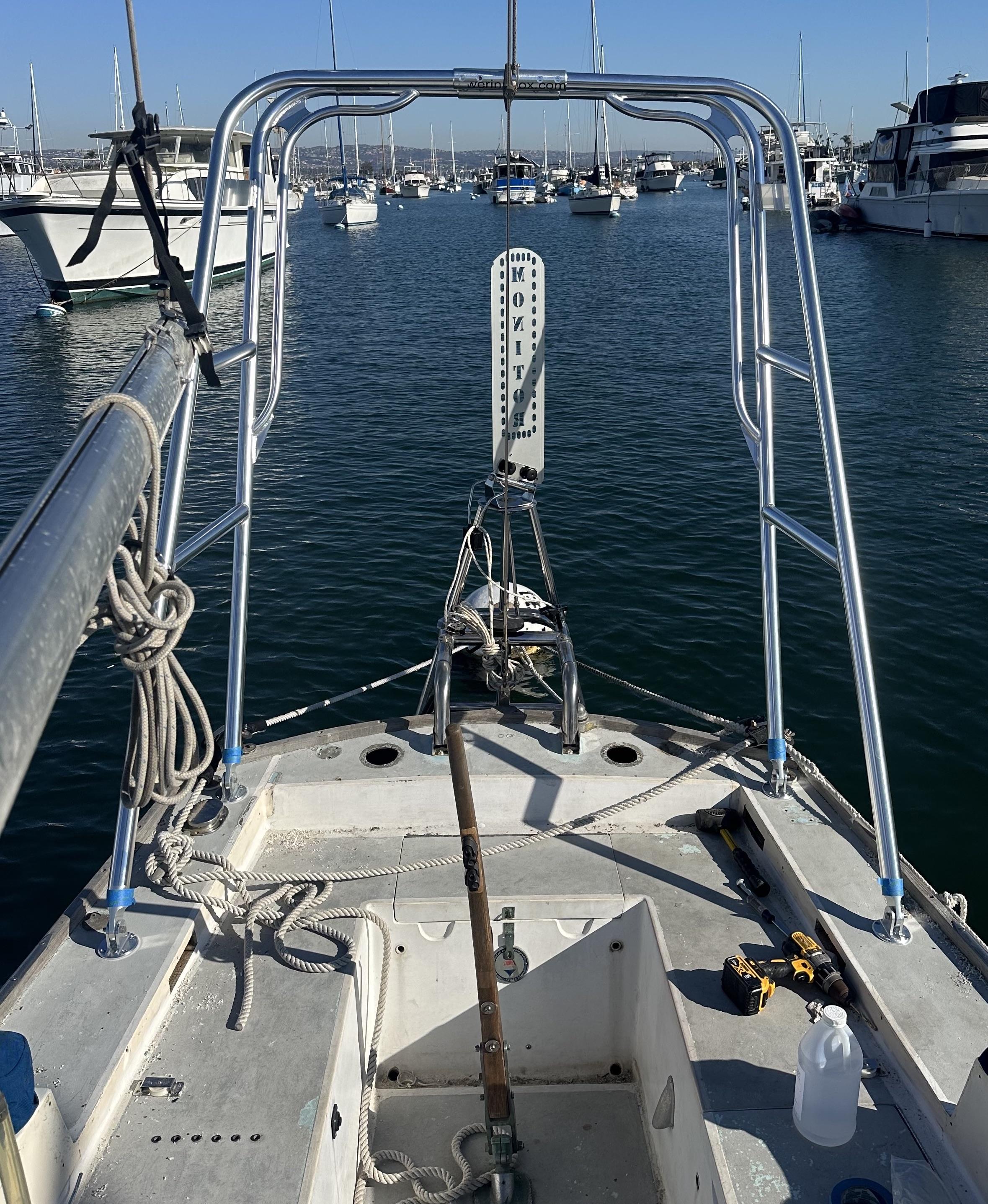 Atlantic Towers Arch installed on a boat's deck, overlooking a marina filled with other vessels.