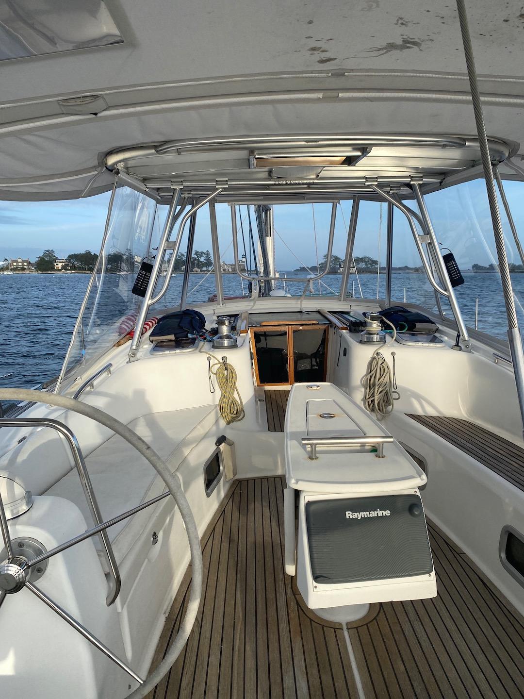 Atlantic Towers Top installed on a Beneteau sailboat cockpit, featuring a navigation station and wood decking.