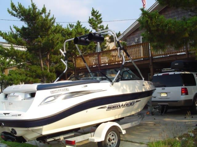 Atlantic Towers Air Tower installed on a Sea Doo 205 Utopia boat parked in a driveway with trees in the background.