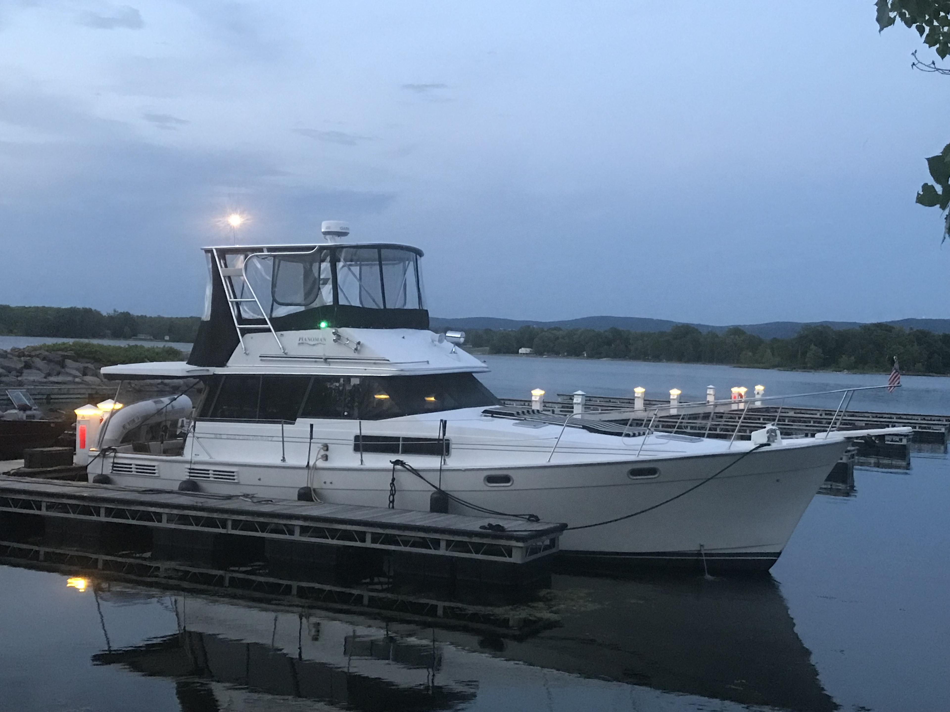 Atlantic Towers Top installed on a Bayliner boat docked at twilight, surrounded by water and a calm marina.