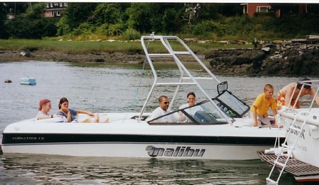 Atlantic Towers Air Tower installed on a Malibu Sunsetter LX boat with passengers enjoying a day on the water.