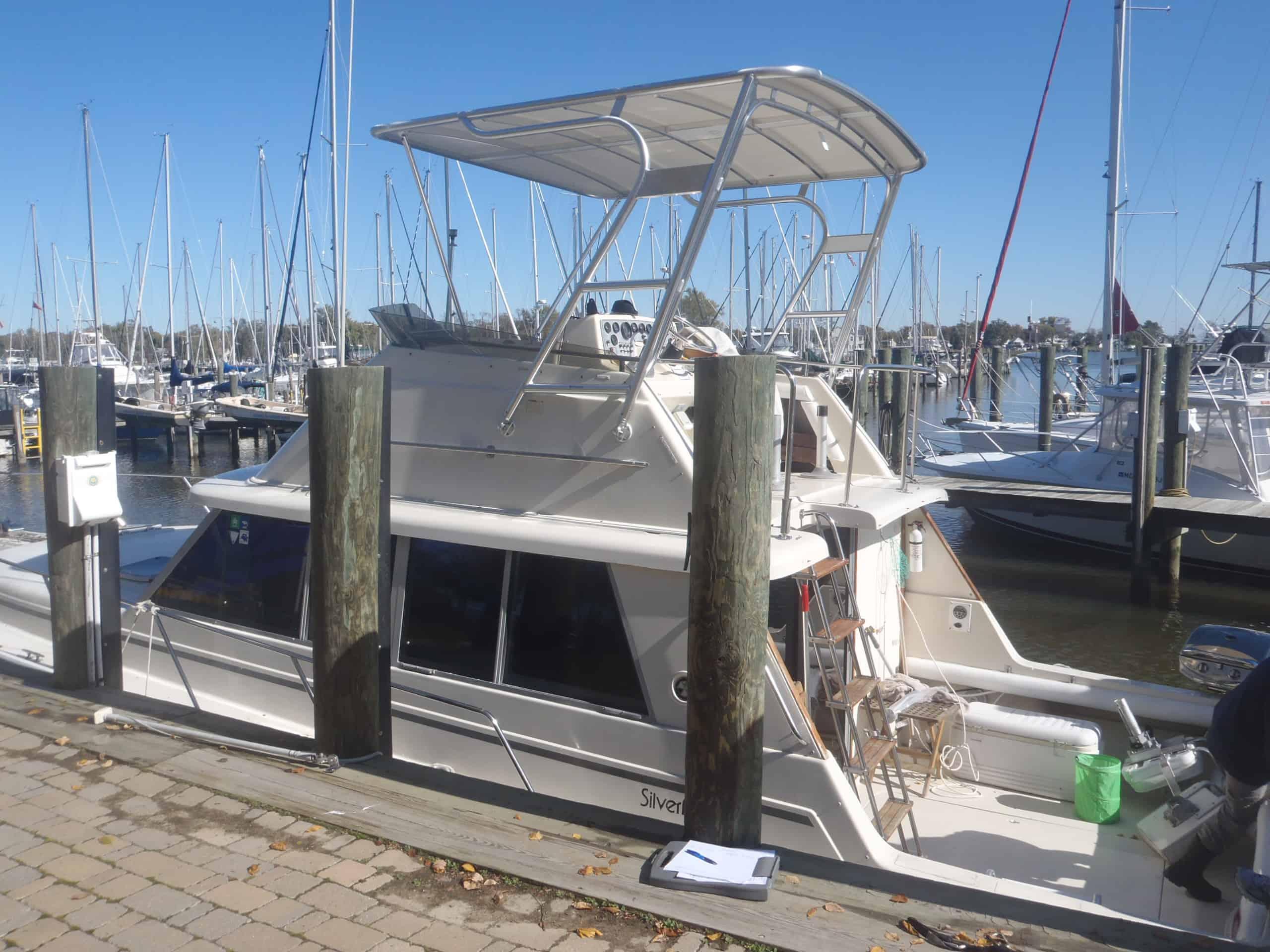 Atlantic Towers Top installed on Silverton 37 Convertible boat, showing frame and canvas enclosure on deck