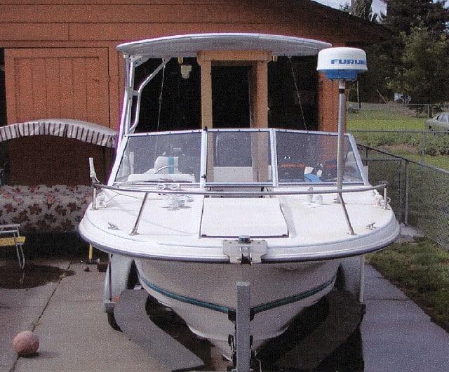 Atlantic Towers Top installed on a Wellcraft V-21 Steplift boat, viewed from the front in a residential area.