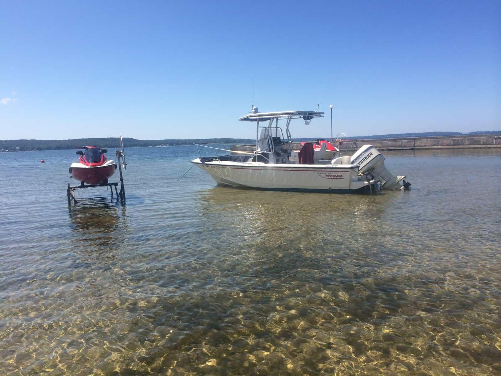 Atlantic Towers T-Top installed on Boston Whaler 21 Outrage center console boat shown from the side view.