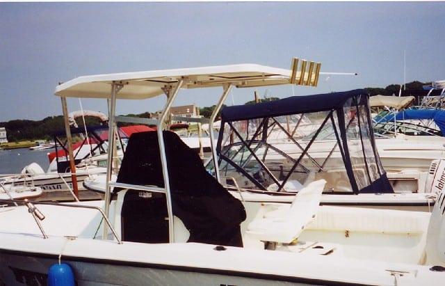 Atlantic Towers T-Top installed on a Hydra Sports 212 Center Console boat docked among other vessels.