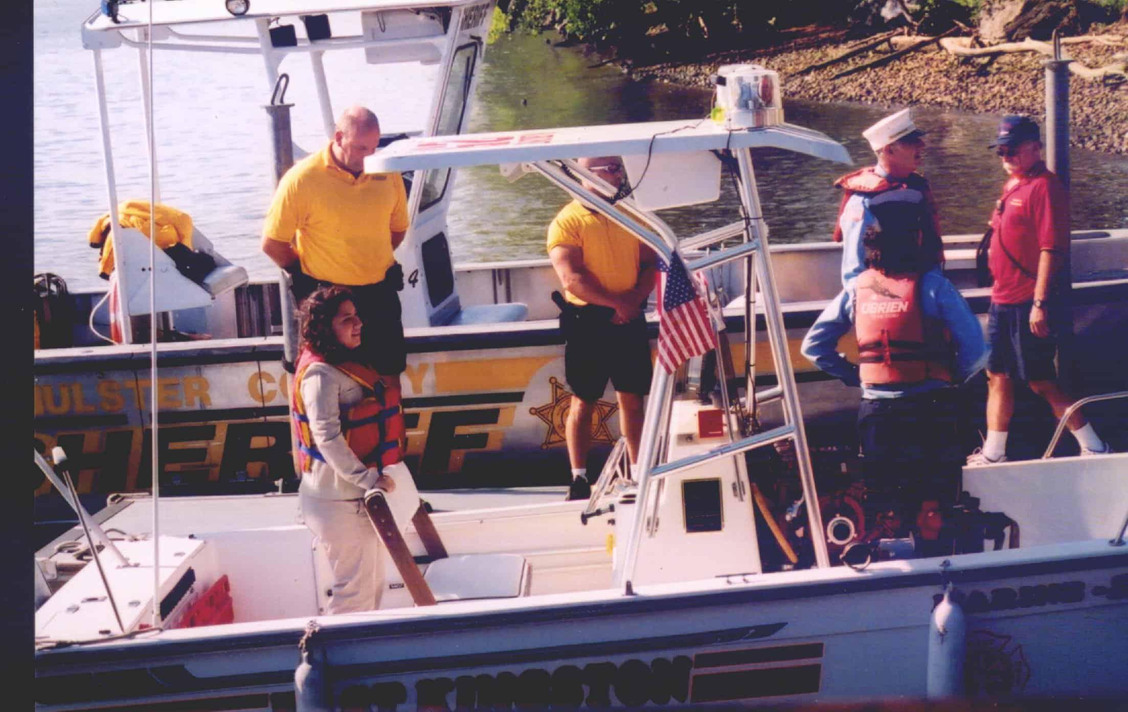 Atlantic Towers T-Top installed on a Sportcraft 20 Center Console boat with individuals in life jackets.