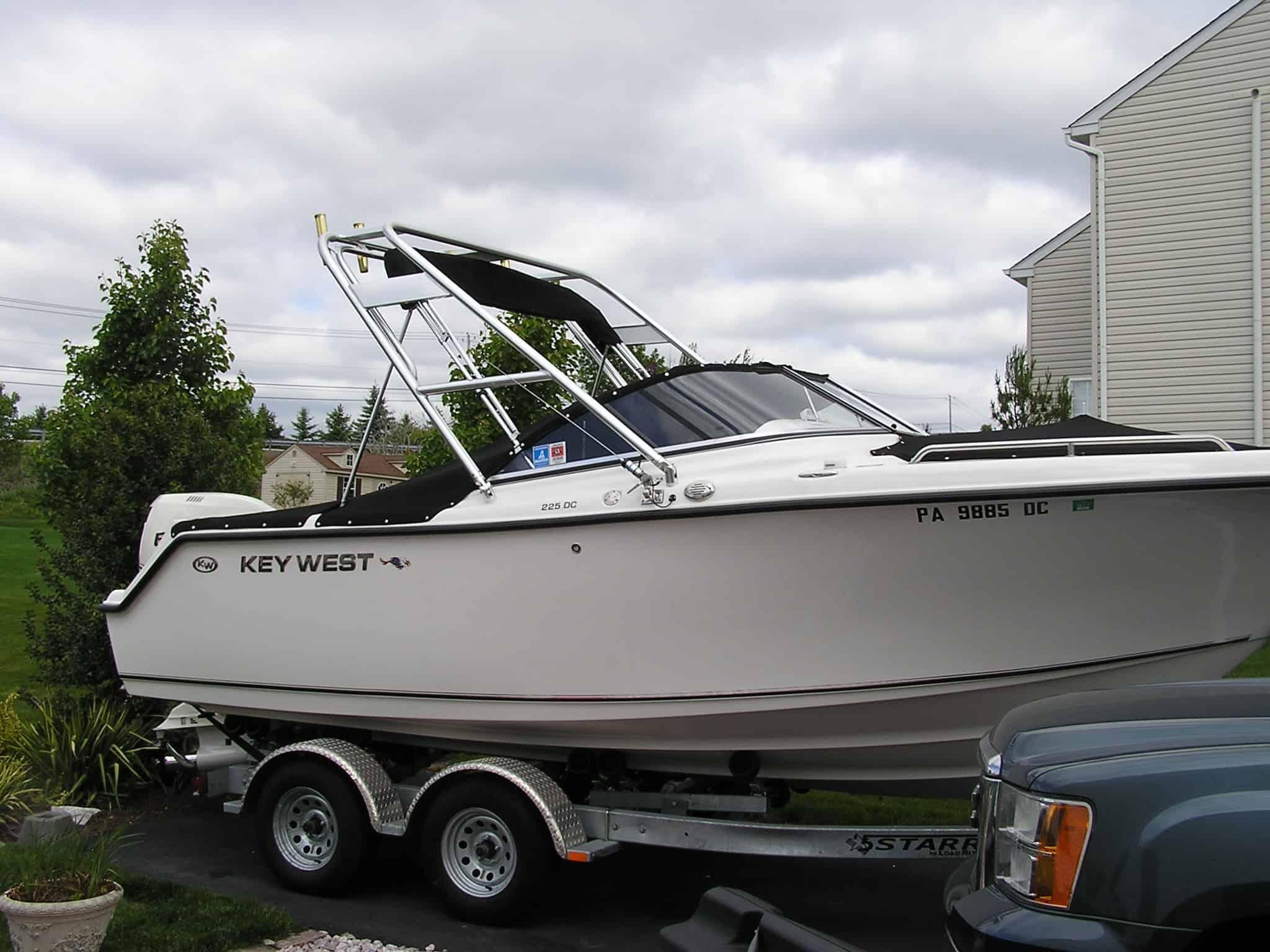 Atlantic Towers arch installed on Key West 225 Dual Console bow rider boat shown from the side on water