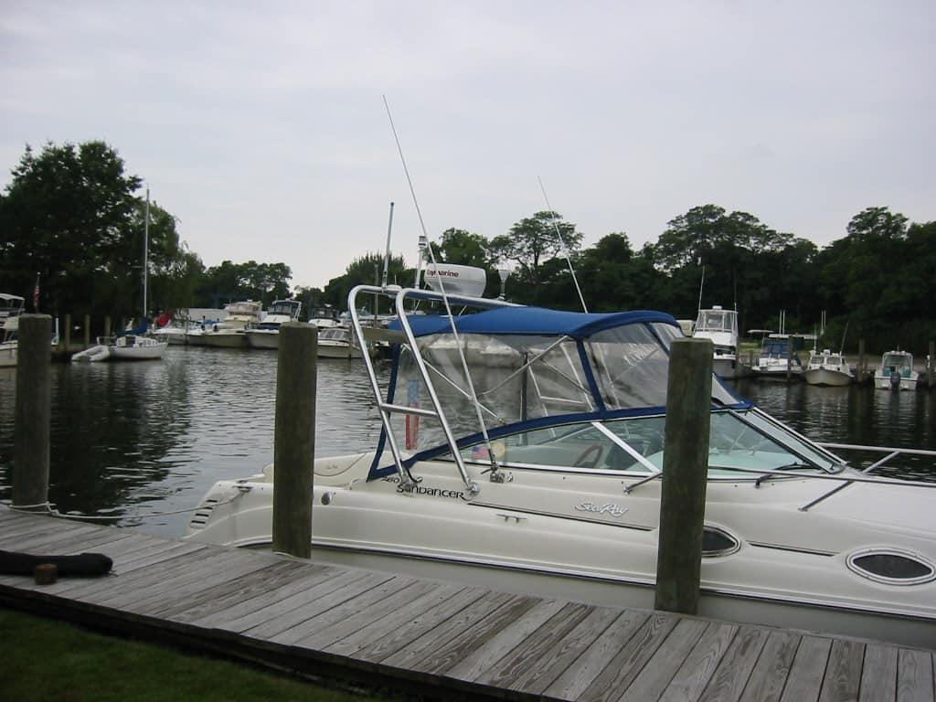 Atlantic Towers Arch on a Sea Ray 260 DA boat docked at a marina with other boats in the background.
