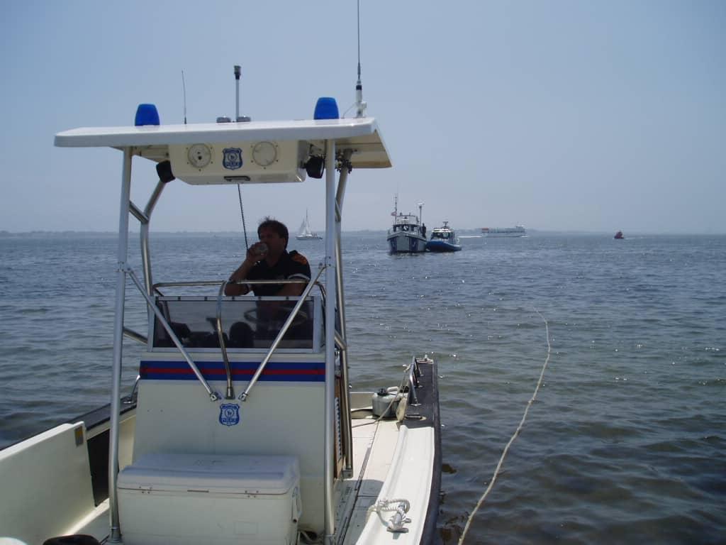 Atlantic Towers T-Top installed on a Boston Whaler 22 Outrage center console boat in calm water.