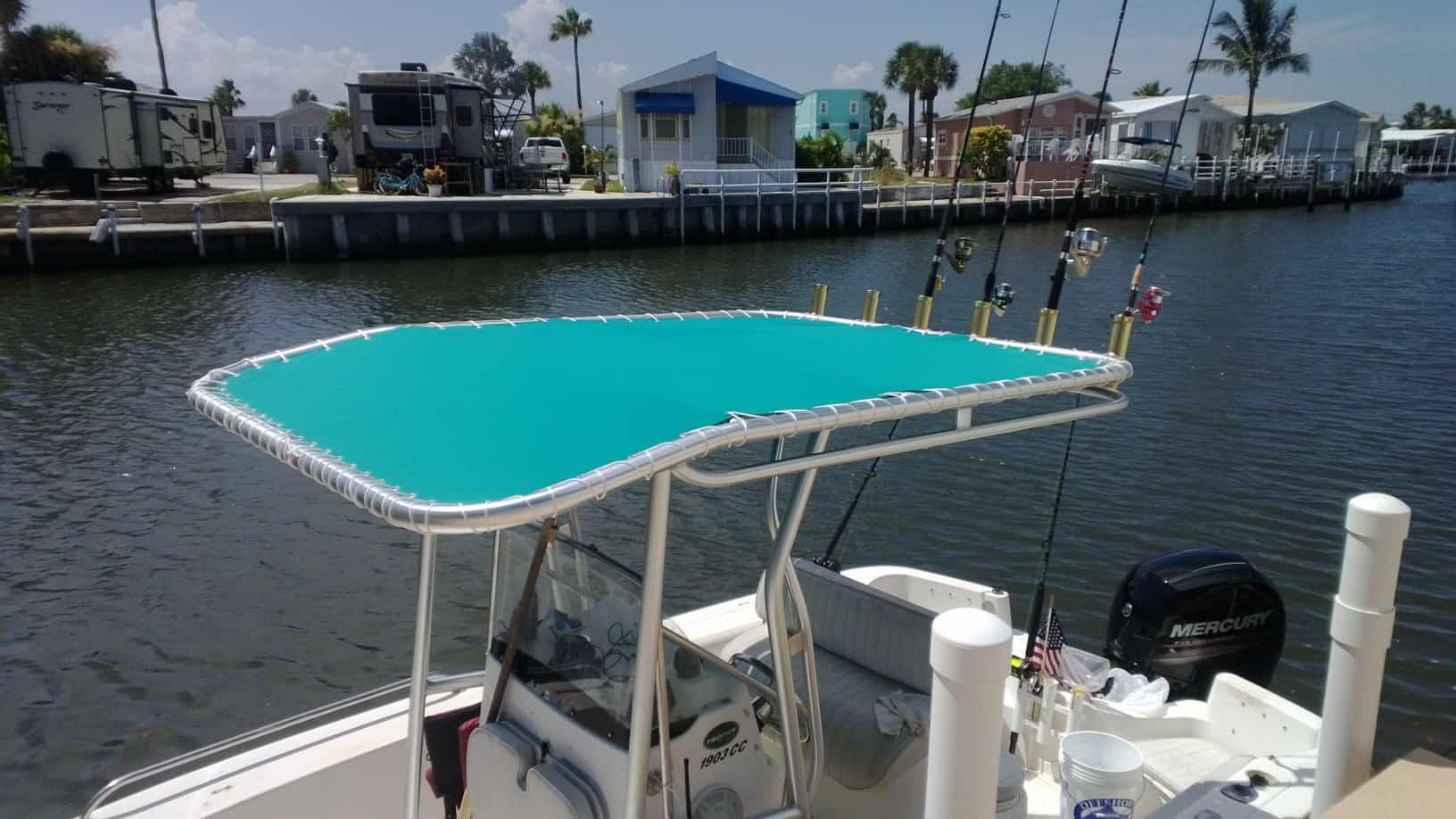 Atlantic Towers T-Top installed on a white Trophy 1903 center console boat on calm water under clear sky