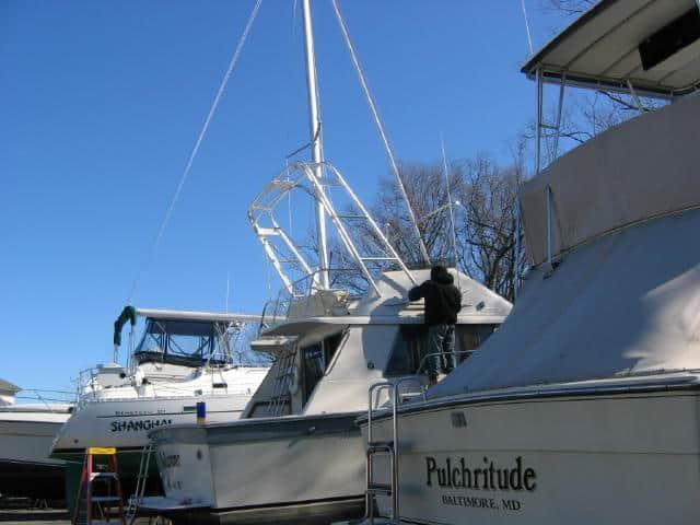 Silverton 34C Convertible boat with installed Atlantic Towers Arch, viewed from the back on the water.