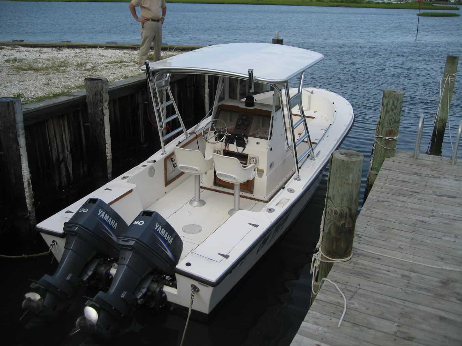 Atlantic Towers Top installed on a Mako 231 center console boat, showing the helm and ocean background.