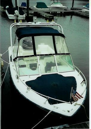Atlantic Towers arch installed on a Grady White 19 Tournament boat, docked in a marina with moored vessels in the background.