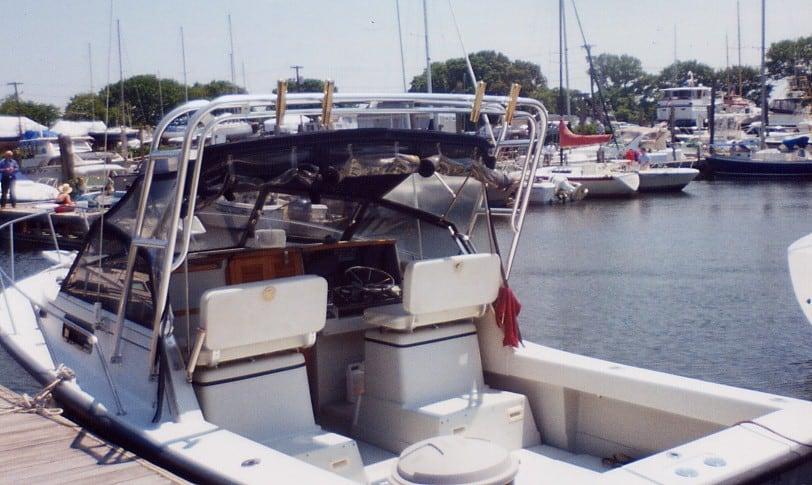 Atlantic Towers Arch installed on a Rampage 28 Sportsman boat at a marina, with other boats visible in the background.