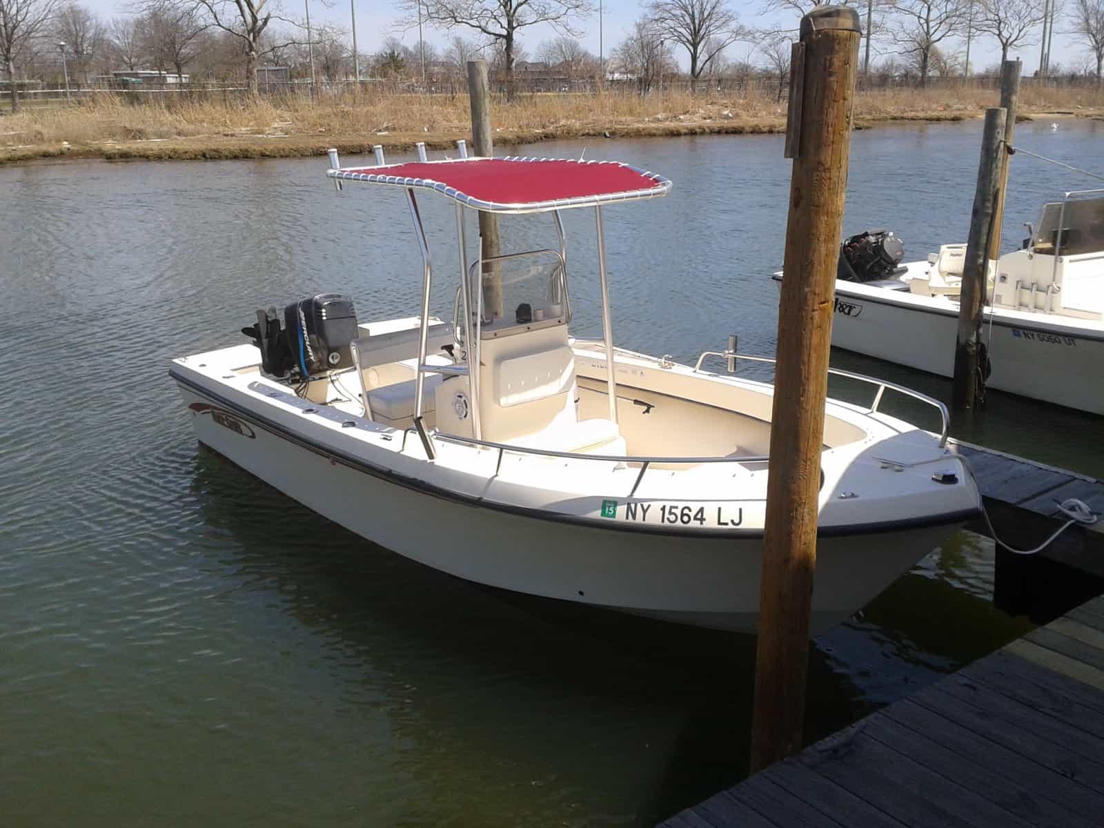 Atlantic Towers T-Top installed on a May Craft 20 center console boat, showing structural support and shade canopy.