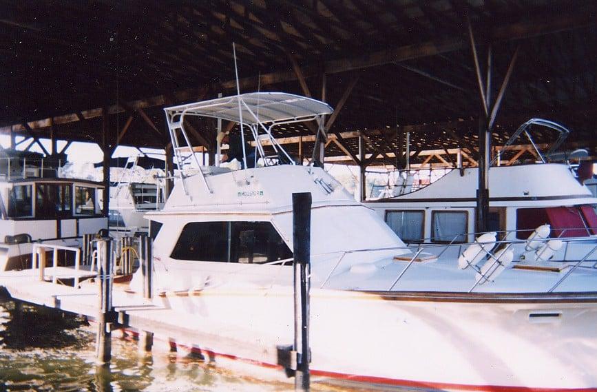 Atlantic Towers Top installed on an Egg Harbor 38 boat docked in a covered marina.