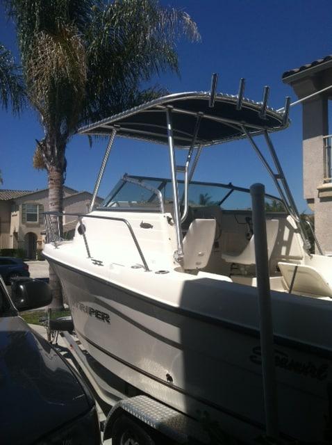 Atlantic Towers top installed on a Seaswirl 2100 Striper walkaround boat in a dock setting.