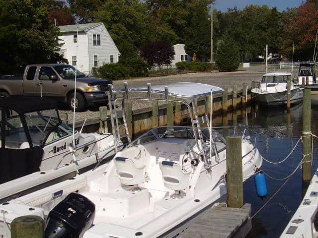Atlantic Towers Top installed on a Pro Line 201 Walkaround boat at a marina, with other boats docked nearby.