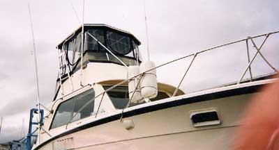 Atlantic Towers Top installed on a Hattaras 36 Convertible boat showing the upper helm area with enclosure.