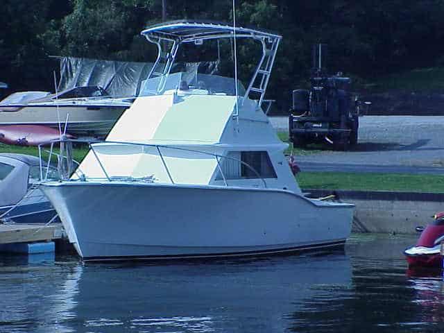 White Hattaras 28 Sportfish boat docked with installed Atlantic Towers Top on the flybridge above the cabin.