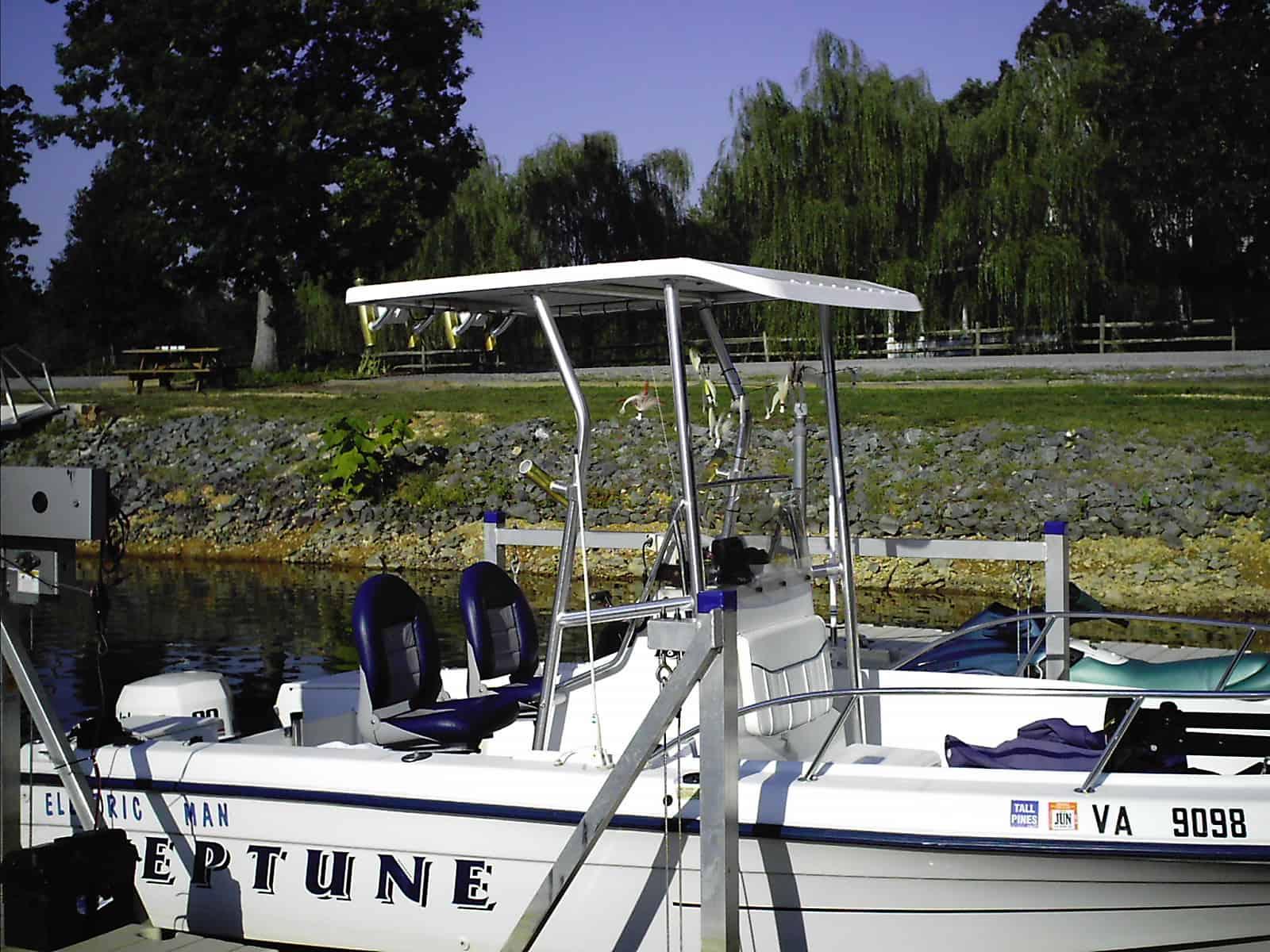 Atlantic Towers T-Top installed on a Neptune 18 Sunbird center console boat on a trailer outdoors.