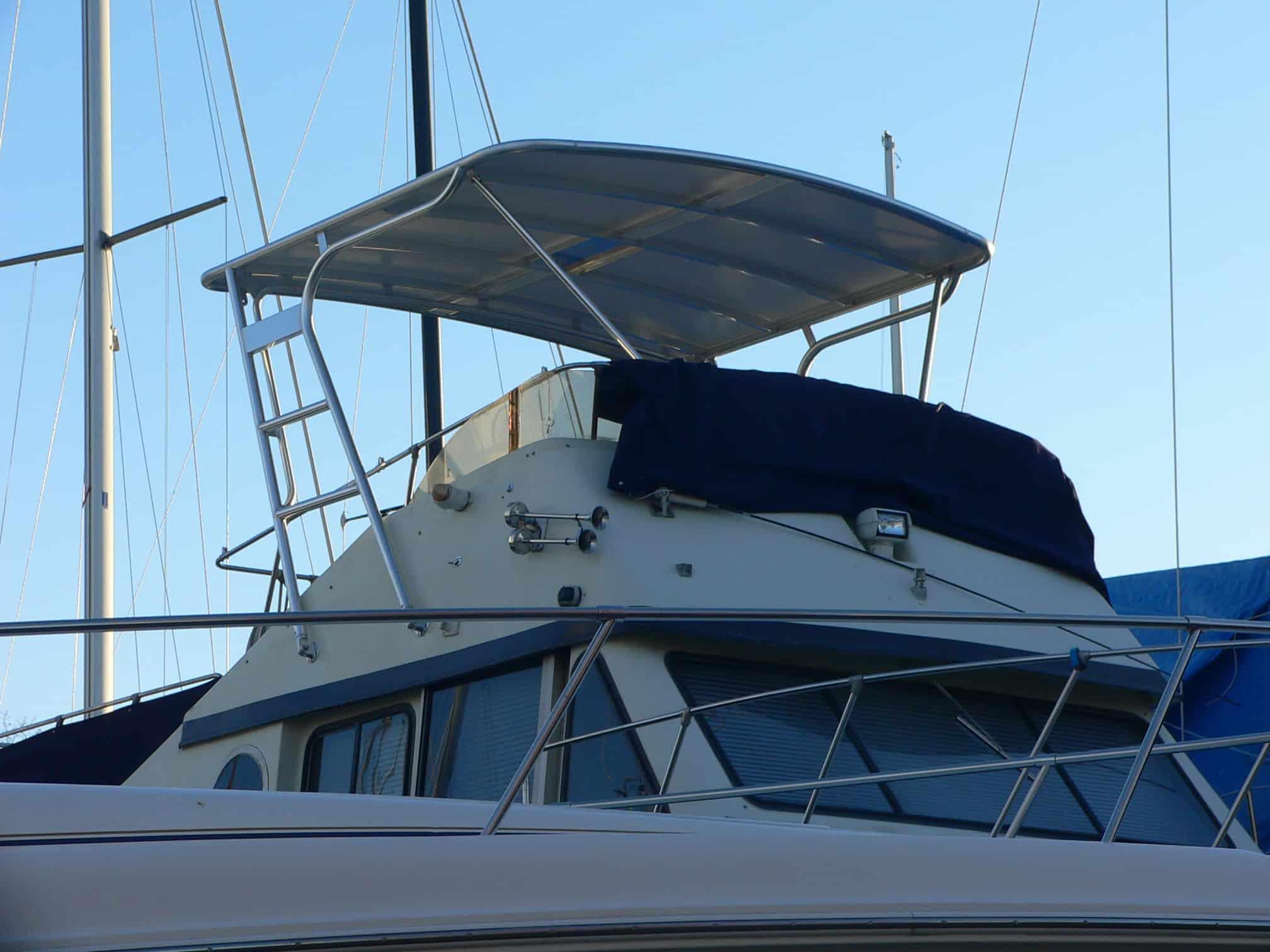 Atlantic Towers Top installed on a Blue Water Boats 40 Coastal Cruiser houseboat, showcasing its sleek design.
