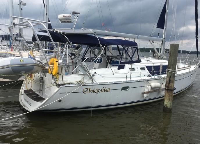 A Jeanneau sailboat named Chiquita featuring an Atlantic Towers Arch in a marina setting.