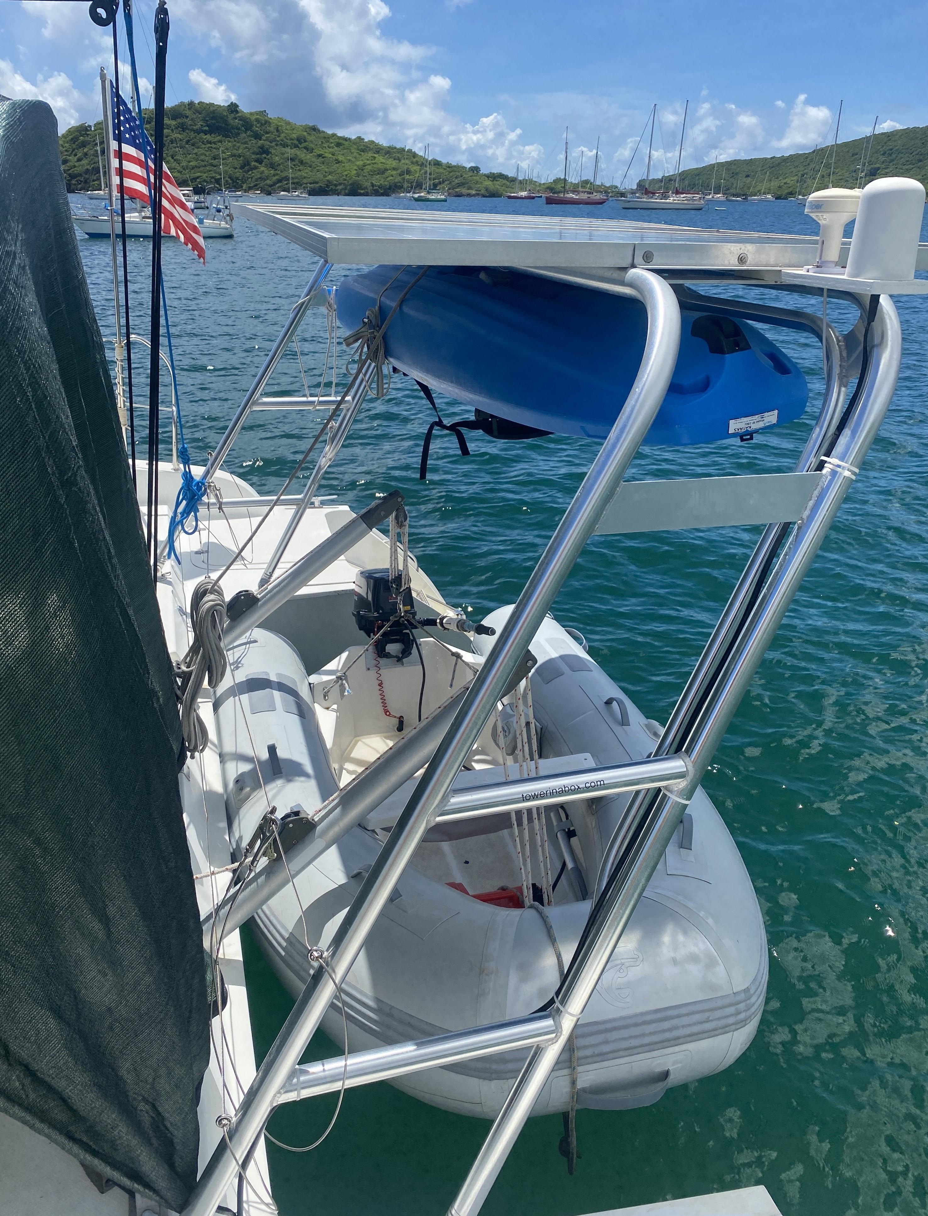 Atlantic Towers Arch aluminum frame mounted on a Fountaine Pajot boat with a blue kayak and dinghy stored overhead.