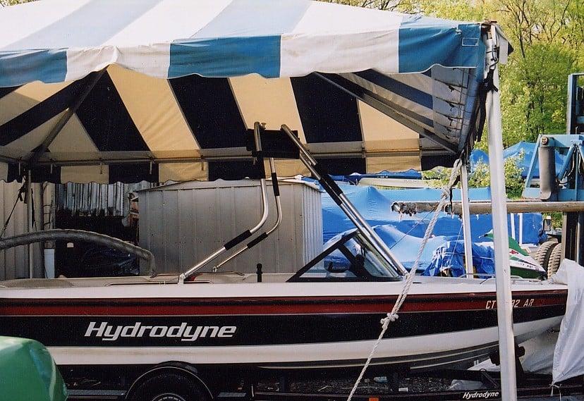 Atlantic Towers Air Tower installed on a Hydrodyne 20 Grandsport boat under a striped tent.