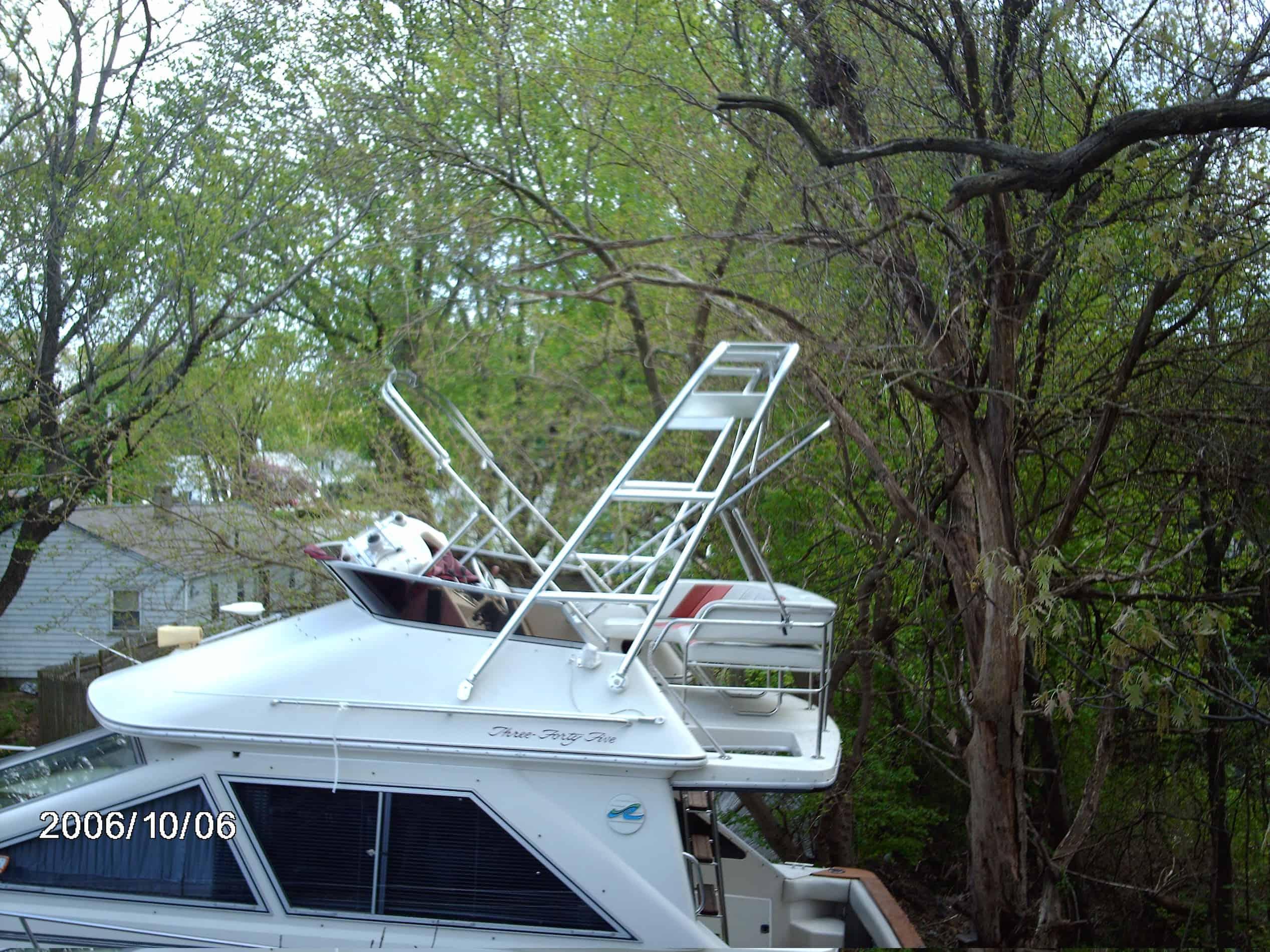 Atlantic Towers Arch installed on a Sea Ray 340/345 sedan boat shown from the side on the water.