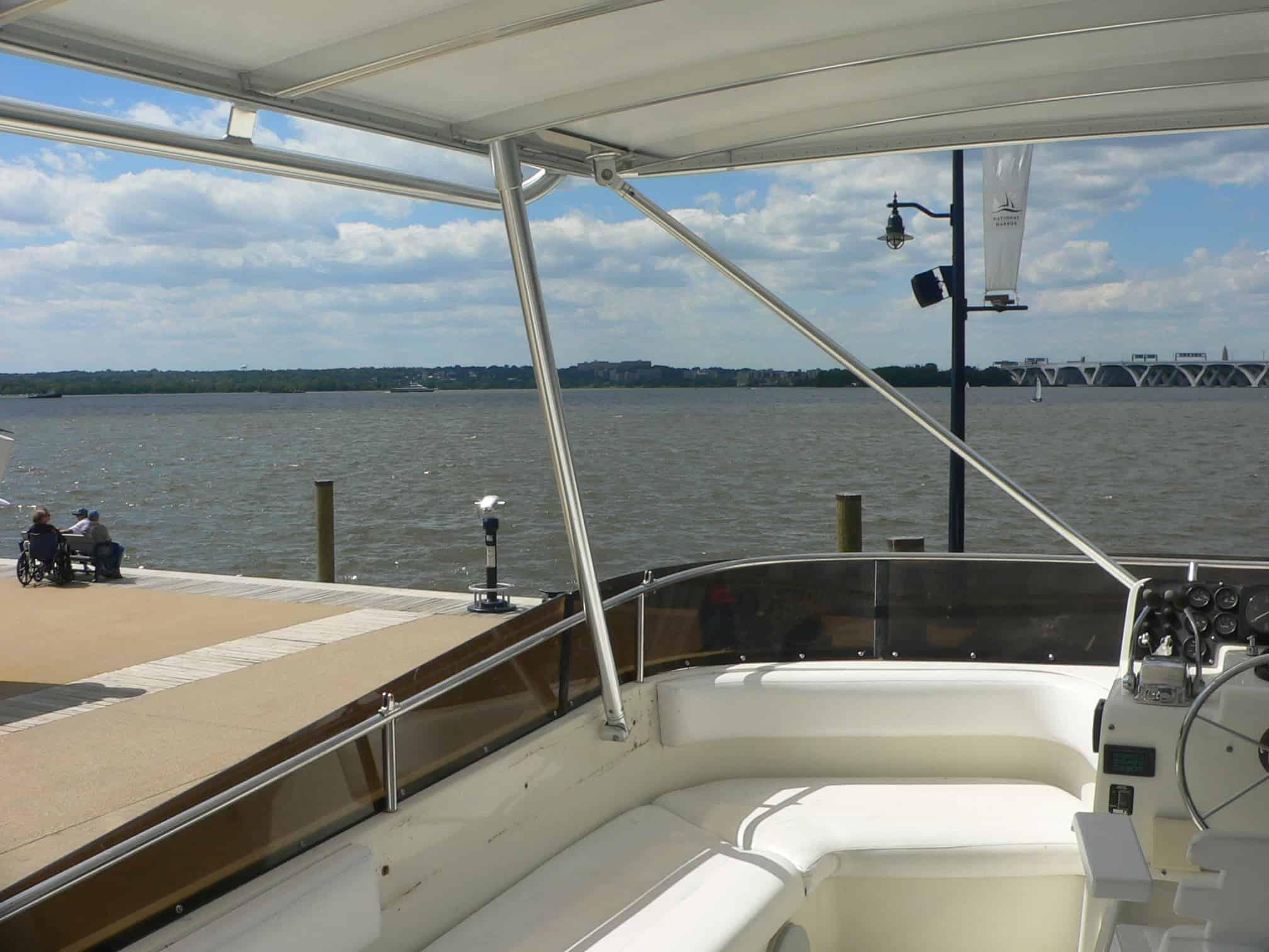 Atlantic Towers Top installed on Silverton 46 motor yacht, viewed from the rear on calm water under blue sky.