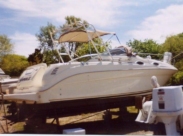 Atlantic Towers arch installed on a Sea Ray 260 Sundancer boat, resting on supports in a marina setting.