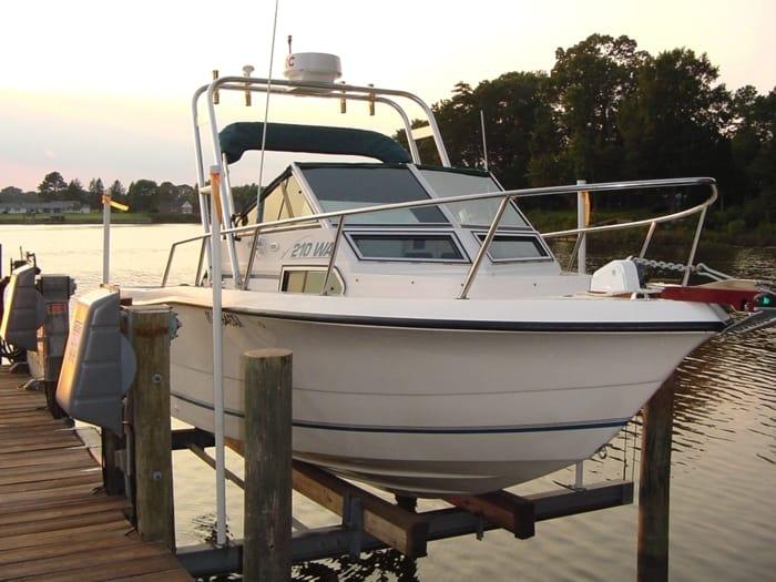 Atlantic Towers Arch on a Sea Pro 210 W/A boat docked on a wooden pier at sunset.