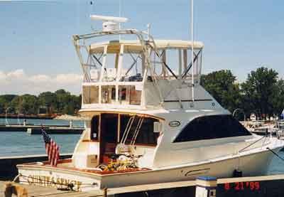 Atlantic Towers arch installed on an Ocean 38 Super Sport boat at a dock with a scenic background.