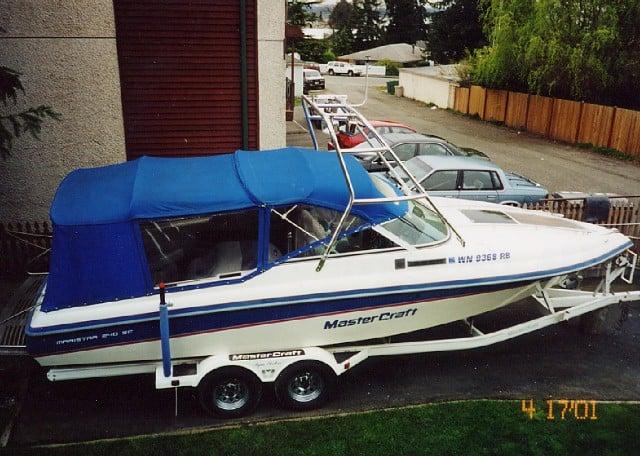 Mastercraft 240 Maristar boat on trailer with blue canvas cover and installed Atlantic Towers Air Tower arch