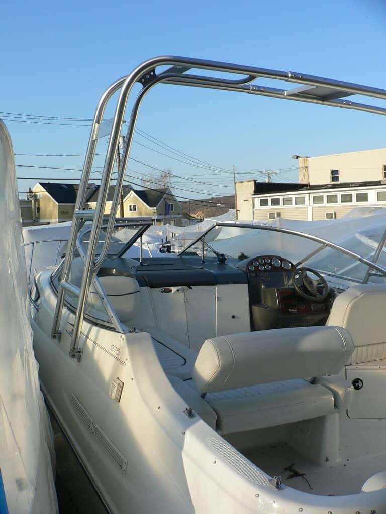Atlantic Towers arch installed on a Bayliner 275 Cruiser, showcasing the boat's interior and dashboard.