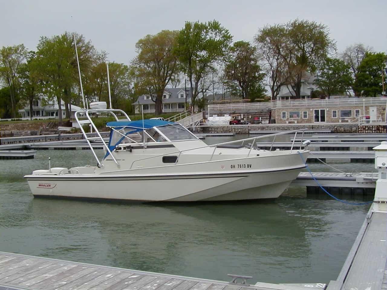 Atlantic Towers Arch installed on a Boston Whaler 25 Revenge boat docked at a marina.