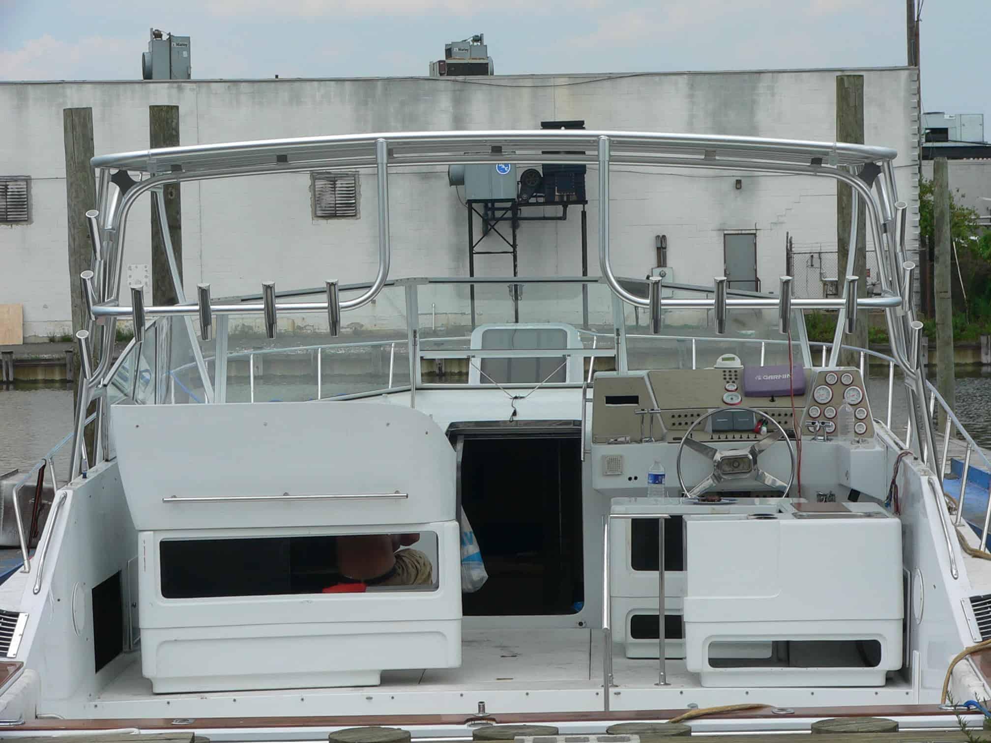 Alt text: Atlantic Towers Top installed on a Trojan 13 Meter Express boat, showcasing the rear cockpit and helm area.